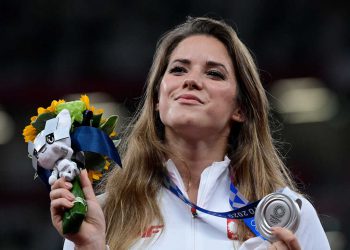 Silver medallist Poland's Maria Andrejczyk celebrates on the podium during the victory ceremony for  the women's javelin throw event during the Tokyo 2020 Olympic Games at the Olympic Stadium in Tokyo on August 7, 2021. (Photo by Javier SORIANO / AFP) (Photo by JAVIER SORIANO/AFP via Getty Images)