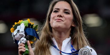 Silver medallist Poland's Maria Andrejczyk celebrates on the podium during the victory ceremony for  the women's javelin throw event during the Tokyo 2020 Olympic Games at the Olympic Stadium in Tokyo on August 7, 2021. (Photo by Javier SORIANO / AFP) (Photo by JAVIER SORIANO/AFP via Getty Images)