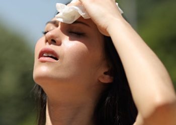 Asian woman drying sweat in a warm summer day