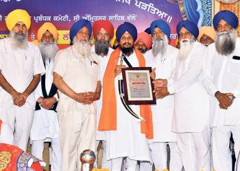 Dharam Prachar Committee, Bhai Waryam Singh and Bhai . management of Gurdwara Baba Makhan Shah Lobana, New York, honoured the Jathedar of Sri Akal Takht Sahib Giani Harpreet Singh in Amritsar on Saturday photo The Tribune