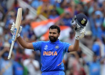 India's Rohit Sharma celebrates after scoring a century (100 runs) during the 2019 Cricket World Cup group stage match between Bangladesh and India at Edgbaston in Birmingham, central England, on July 2, 2019. (Photo by Dibyangshu Sarkar / AFP) / RESTRICTED TO EDITORIAL USE        (Photo credit should read DIBYANGSHU SARKAR/AFP via Getty Images)