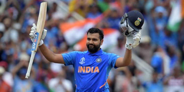 India's Rohit Sharma celebrates after scoring a century (100 runs) during the 2019 Cricket World Cup group stage match between Bangladesh and India at Edgbaston in Birmingham, central England, on July 2, 2019. (Photo by Dibyangshu Sarkar / AFP) / RESTRICTED TO EDITORIAL USE        (Photo credit should read DIBYANGSHU SARKAR/AFP via Getty Images)