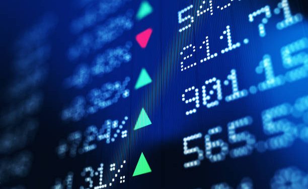 Financial data analysis graph showing stock market trends on a trading board. Horizontal composition with copy space and selective focus.