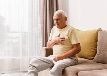 Senior man have pain in chest. Concepts of different problems like acid reflux or heart attack.