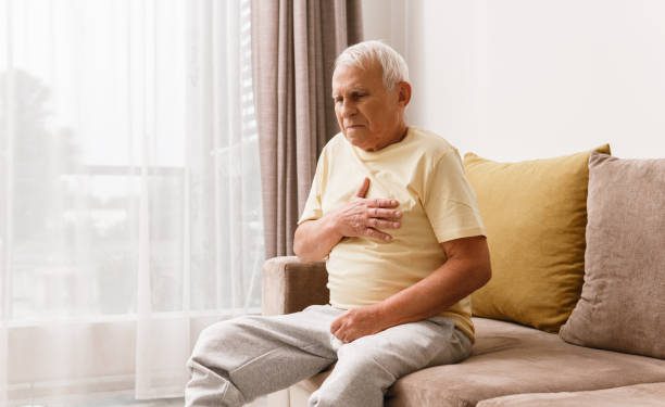 Senior man have pain in chest. Concepts of different problems like acid reflux or heart attack.