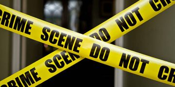 Crime scene tape over doorway
