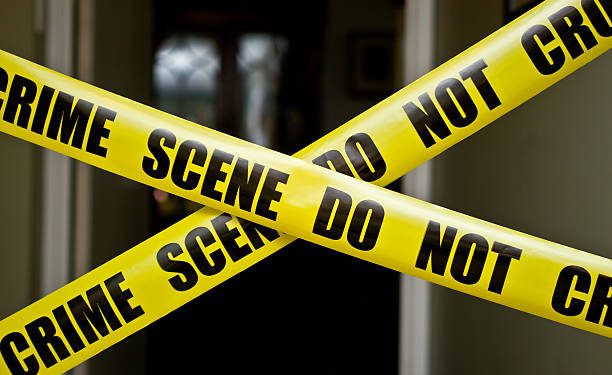 Crime scene tape over doorway