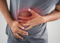 The Photo Of Liver On Man's Body Against Gray Background, Hepatitis, Concept with Healthcare And Medicine
